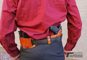 An ideal system for use when suits are worn: The very flat and concealable Deep Concealment Tuckable holster, a Holster belt, and a leather magazine pouch. Notice how tightly the pistol and magazines fit to the body.